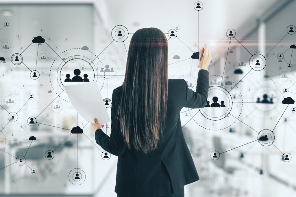 Young woman drawing social network interface